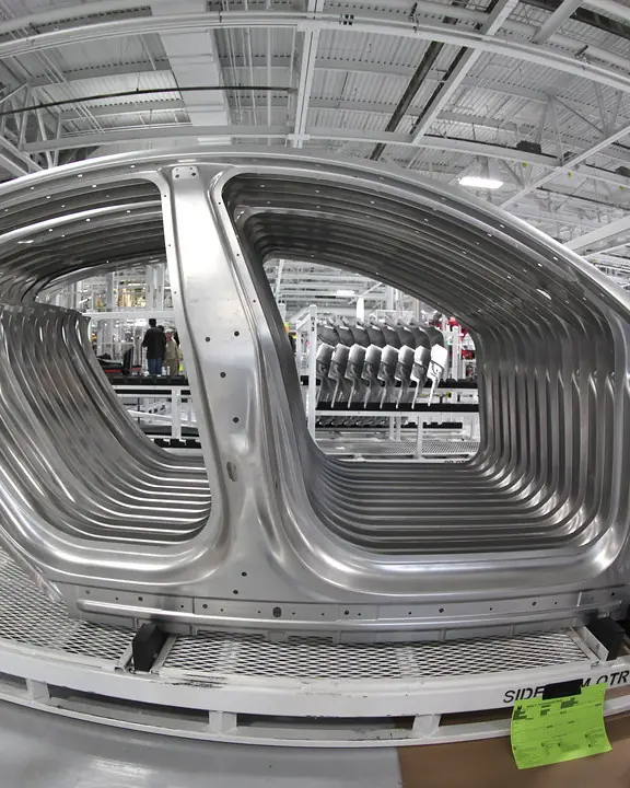 Robot arms on an automated assembly line